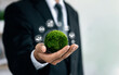 © Deemerwha studio - Business responsible environmental, social, and governance. Businessmen holding the world to Organization Sustainable development environmental. Sustainable business or green company Concept.