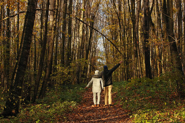 Young adult son and mother in the autumn forest. Pavel, i and my Mother Marina and autumn forest around us. Photo was taken 14 October 2022 year, MSK time in Russia.