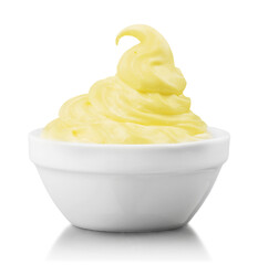 Canvas Print - Close-up of fresh yellow cream in white bowl isolated on white background