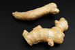 Ginger root photographed against a dark background