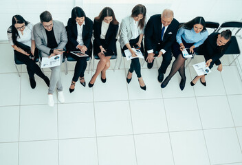 Wall Mural - top view. the Manager holds a meeting with the business team.