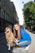 © BillionPhotos.com - Cute dog walks with owner at street