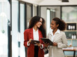 © PaeGAG - two women discussing business plans in the office