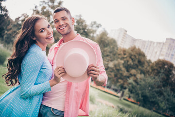 Wall Mural - Photo session natural park forest lovely owners new flat romantic cute couple hold pink hat cover smiling healthy relationship