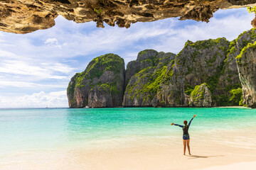 Young Asian lady tourist on the  the beach, Ma Ya bay, Phi Phi island  krabi province Thailand.