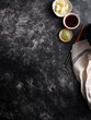 © Food Images - Blank gray background with chopsticks, soy sauce and other condiments kept in small bowls set for food photography