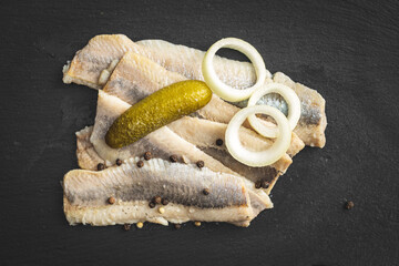 Wall Mural - Marinated herring fish on kitchen table.