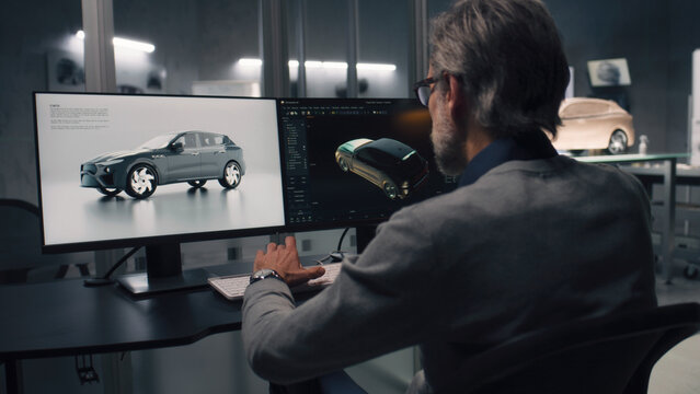 Two male automotive designers working on model of eco friendly electric car in modern car design studio. One working in 3D modeling computer software, other sculpting with plasticine clay and rake.