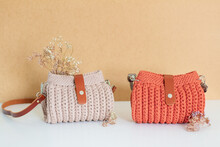 Woman Trendy Crochet Purse On Beige Background. Fashion Concept