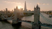 Iconic Tower Bridge At Sunset. Connecting London With Southwark On The Thames River. Aerial Sunset View Of London City Center And The Tower Bridge Of London. 