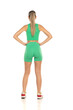 © vladimirfloyd - young sporty woman in green shorts and top posing on white studio background. Back view
