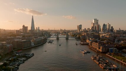 Wall Mural - Iconic Tower Bridge at sunset. Connecting London with Southwark on the Thames River. Aerial sunset view of London city center and the Tower bridge of London. 