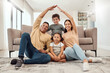© Beaunitta V W/peopleimages.com - Roof, children and parents with security in their house with love, care and safety in the living room together. Portrait of happy, smile and young mother and father with insurance for their family