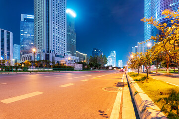 Wall Mural - the light trails on the modern building background in shanghai china.