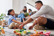 © Beaunitta Van Wyk/peopleimages.com - Learning, education and family play with blocks with father and creative daughter playing together in living room. Childhood, development or parent, mother or mom reading story book to girl on sofa