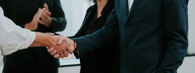 successful negotiate and meeting handshake concept, businessman partner person shake hand with to celebration partnership and teamwork to success business deal agreements contract