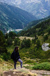 © GonzaloVega - hiker admiring the trail in the mountains. young woman takes a break on her way to the top of the mountain. she is alone but self-confident, persistent and full of vitality.