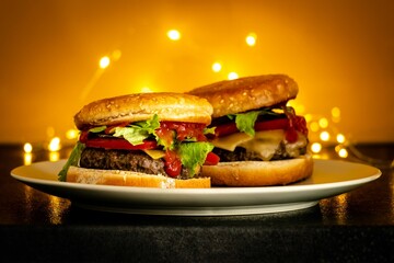 Wall Mural - Two pieces hamburger on a white plate with bokeh background