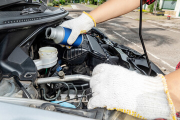 Car mechanic working on engine repair