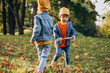 © Petro - Two boys brothers playing together in park