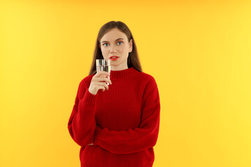 Wall Mural - Concept of people, young woman on yellow background