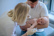 © zinkevych - Pediatric doctor preparing to give an injection to a newborn