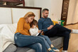 © Svitlana - Caucasian family watching digital tablets at home