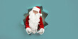 © ZaStock - Emotianal Santa Clause spread arms in forward through paper hole. Advertisement concept