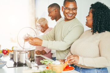 Wall Mural - Happy black family cooking inside kitchen at home - Focus on father face