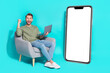 Full size photo of young guy hold laptop yell wear shirt jeans shoes isolated on turquoise background