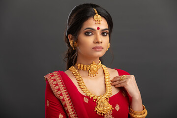 Poster - Pretty Indian young Hindu Bride portrait in studio light.