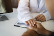 © NINENII - Female doctors shake hands with patients encouraging each other. To offer love, concern, and encouragement while checking the patient's health. concept of medicine.