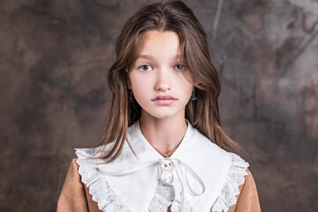 Wall Mural - Studio portrait of a young teen girl