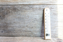 Wooden Thermometer On Wooden Surface