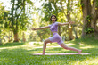 © NanSan - Pretty slim perfect body asian women wear sportswear to playing basic yoga compose.