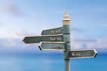 My Way Your Way Our Way No Way Quote Written On Fancy Steel Signpost Outdoors By The Sea. Soft Blue Ocean Bokeh Background.