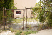 No Trespassing Sign With Old Chain Link Fence
