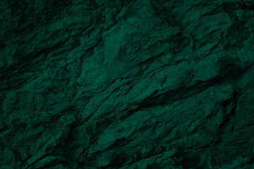 Wall Mural - Rock granite texture. Emerald green color. Toned rough cracked mountain surface. Dark stone grunge background for design. Close-up. Rocky, solid. Fantasy, surreal.