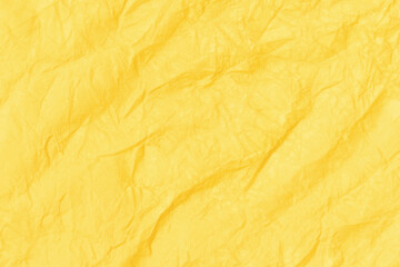 Wall Mural - Crumpled paper abstract background texture. Yellow color. Full frame