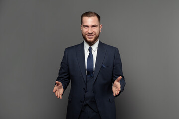 Wall Mural - Handsome successful businessman wearing suit and smiling