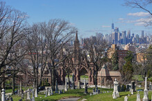 Brooklyn, New York: One World Trade Center (aka Freedom Tower) And The Manhattan Skyline Is Seen In The Distance Over The Gothic Entrance To Historic Green-Wood Cemetery, Founded In 1838.