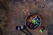 © Карина Клачук - Three ramekins with chocolate mousse with blueberries, blackberries and fresh mint on a rusty iron background.