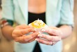 Holding a cupcake