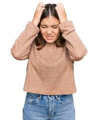 Sticker - Young beautiful woman wearing casual clothes suffering from headache desperate and stressed because pain and migraine. hands on head.