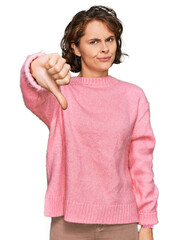 Sticker - Young hispanic woman wearing casual clothes looking unhappy and angry showing rejection and negative with thumbs down gesture. bad expression.