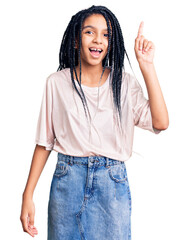 Poster - Cute african american girl wearing casual clothes pointing finger up with successful idea. exited and happy. number one.