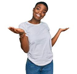 Poster - Young african american woman wearing casual white t shirt clueless and confused expression with arms and hands raised. doubt concept.