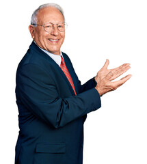 Sticker - Senior man with grey hair wearing business suit and glasses pointing aside with hands open palms showing copy space, presenting advertisement smiling excited happy