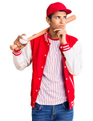 Poster - Young african amercian man playing baseball holding bat and ball serious face thinking about question with hand on chin, thoughtful about confusing idea