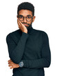 © Krakenimages.com - Young african american man wearing casual clothes thinking looking tired and bored with depression problems with crossed arms.